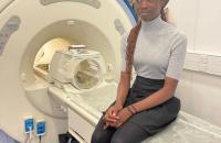 One of our Youth Award recipients sitting on an MRI mock-up
