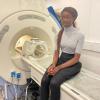 One of our Youth Award recipients sitting on an MRI mock-up